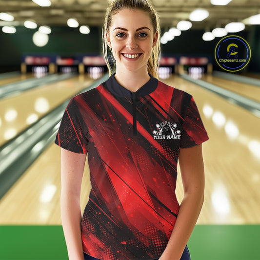 Woman wearing a red and black bowling shirt with a personalized design in a bowling alley.