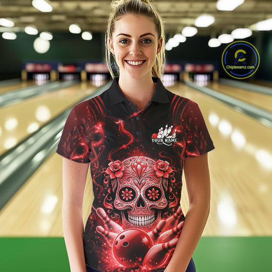 Female model wearing a black and red bowling polo shirt at a bowling lane with Day of the Dead-inspired sugar skull artwork.