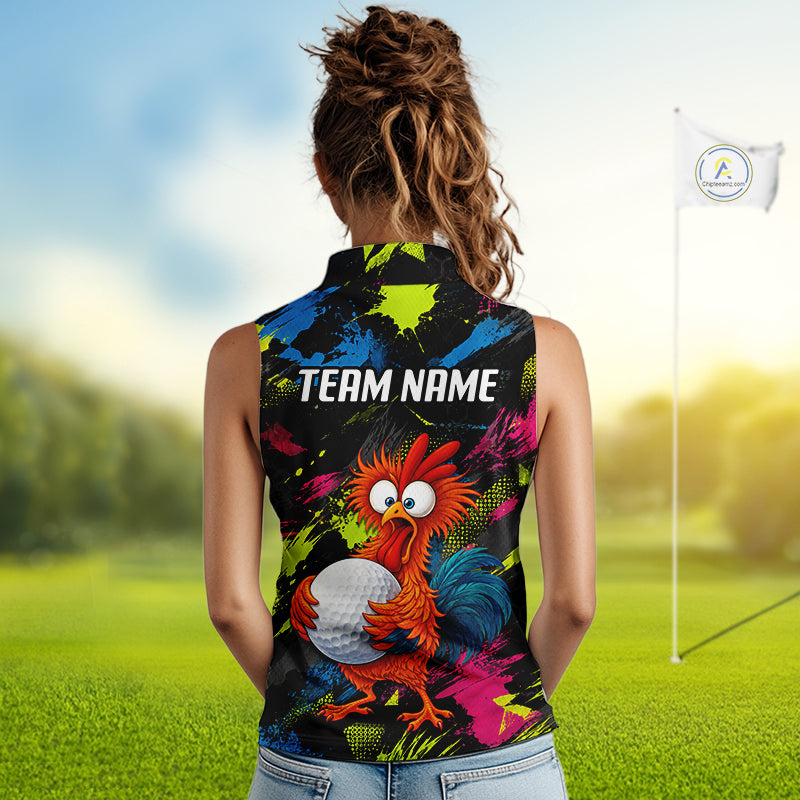 A woman stands on a golf course wearing a sleeveless collared shirt from the back, featuring a colorful cartoon rooster holding a golf ball and the text 'TEAM NAME' in white. The shirt has a black base with bright neon splatter patterns in blue, green, pink, and orange.