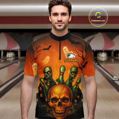 A man wearing a short-sleeve bowling shirt with a Halloween graphic print featuring a skull, green zombies, ghosts, and bats on an orange background. The shirt has a black collar and a black zipper at the neck, with 'YOUR NAME' printed on the chest.