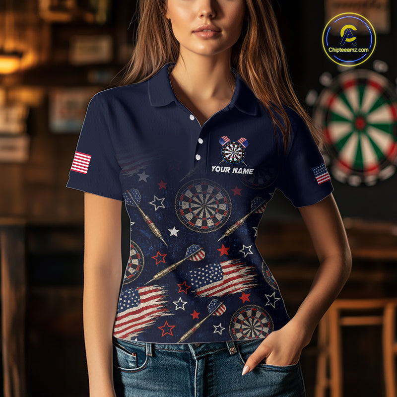A man wearing a custom navy dart polo shirt featuring a distressed American flag graphic in a professional dart room.