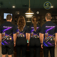 Load image into Gallery viewer, Four people standing side by side in a billiards room, viewed from behind, wearing matching dark navy short-sleeve team shirts with a vibrant purple and blue 8-ball pool graphic and 'TEAM NAME' printed across the back.