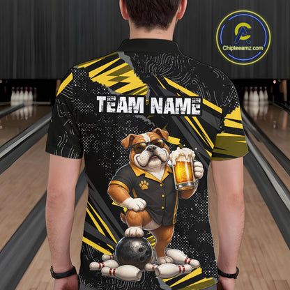 A person shown from the back wearing a black and yellow bowling-themed short-sleeve shirt with a large bulldog graphic holding a beer glass and bowling pins, in a bowling alley.