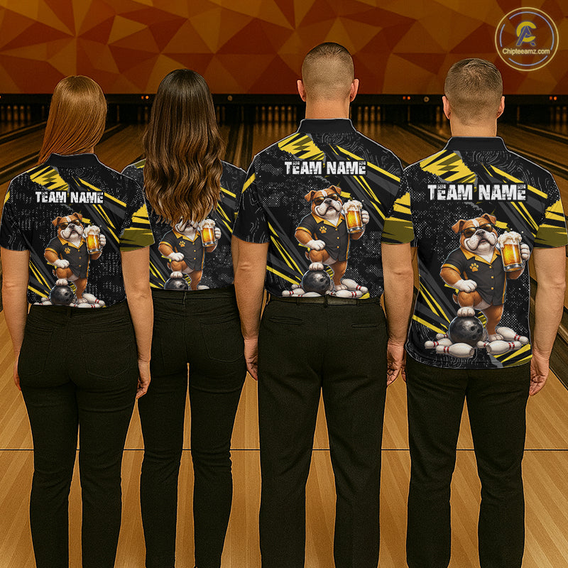 Four people standing from the back in a bowling alley, wearing matching dark navy and yellow bowling-themed shirts with a cartoon bear graphic and 'TEAM NAME' text on the back.