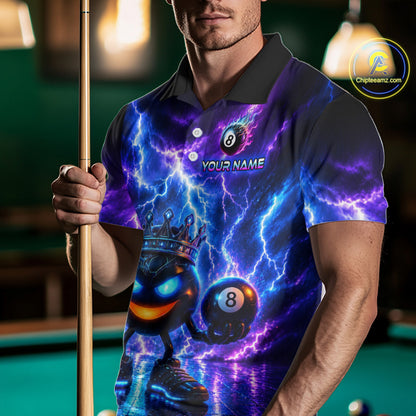 Person wearing a vibrant polo shirt with a pool ball design, holding a pool cue on a billiard table.