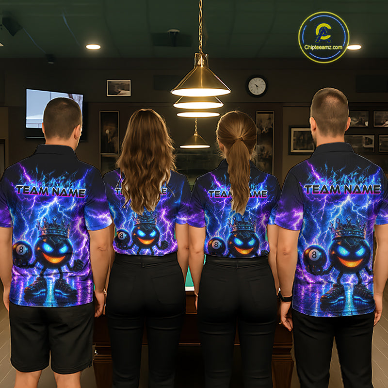 Four people wearing matching team-themed shirts in a room with a pool table.