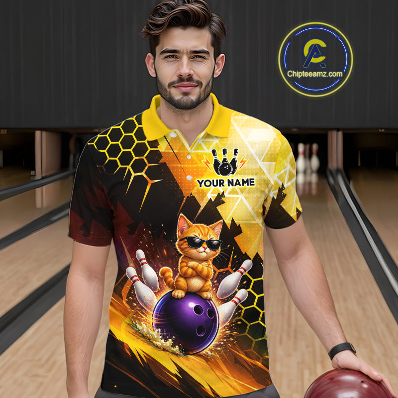 Man wearing a colorful bowling-themed shirt with a cat design in a bowling alley.