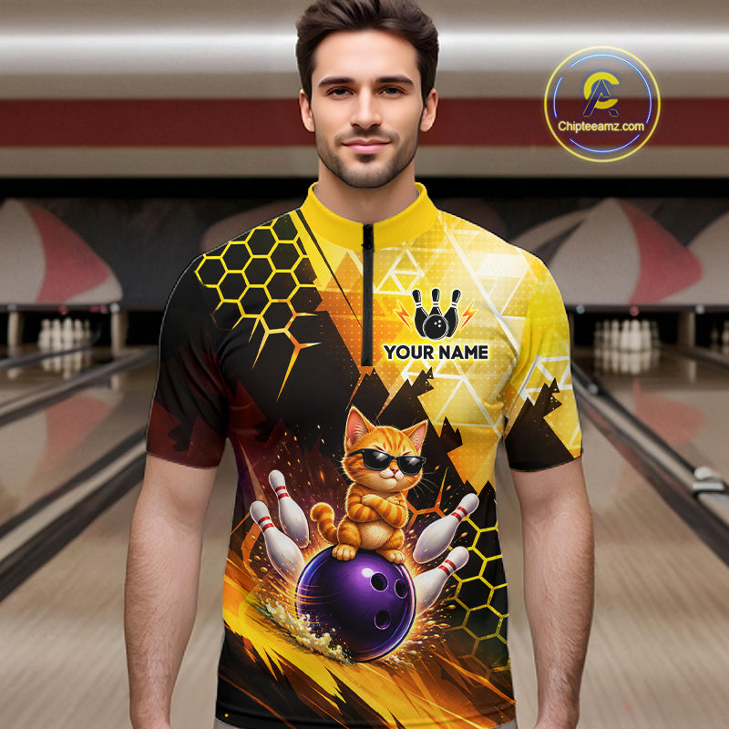 Man wearing a bowling jersey with a cat design in a bowling alley.