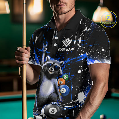 Person wearing a black polo shirt with a raccoon design holding a pool cue in a billiards setting.