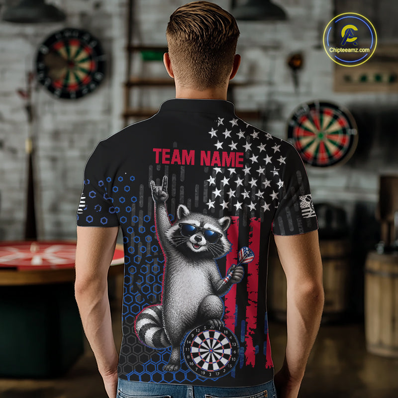 Back view of a man wearing a custom patriotic dart polo with personalized team name and an American flag raccoon holding darts beside a dartboard in a professional dart room.