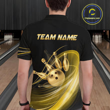 Load image into Gallery viewer, Person wearing a black bowling shirt with gold graphics and 'TEAM NAME' text in a bowling alley.