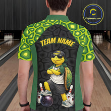 Load image into Gallery viewer, Man wearing custom green turtle bowling polo shirt back view featuring a bowling ball and green hexagon pattern, displaying Team Name, at the bowling alley