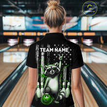 Load image into Gallery viewer, Person wearing a black shirt with a raccoon graphic and 'TEAM NAME' text in a bowling alley.