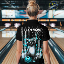 Load image into Gallery viewer, Person wearing a black shirt with a raccoon graphic and 'TEAM NAME' text in a bowling alley.