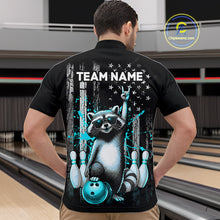 Load image into Gallery viewer, Person wearing a black shirt with a raccoon graphic and 'TEAM NAME' text in a bowling alley.