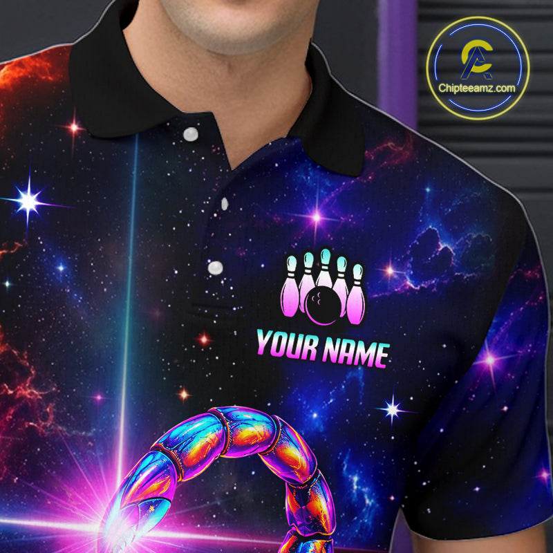 A close-up of a person wearing a short-sleeve polo shirt with a black collar and a vivid space-themed print featuring stars, nebulae, bowling pins, a bowling ball, and a neon scorpion graphic. The shirt includes the text 'YOUR NAME' with a bowling pins icon above it.