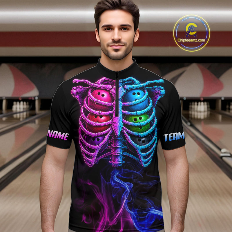A man wearing a black short-sleeve jersey with a vibrant neon graphic of a rib cage split down the middle, with bowling balls inside. The left side is pink/magenta and the right side is blue/cyan, with 'NAME' on the left sleeve and 'TEAM' on the right sleeve.