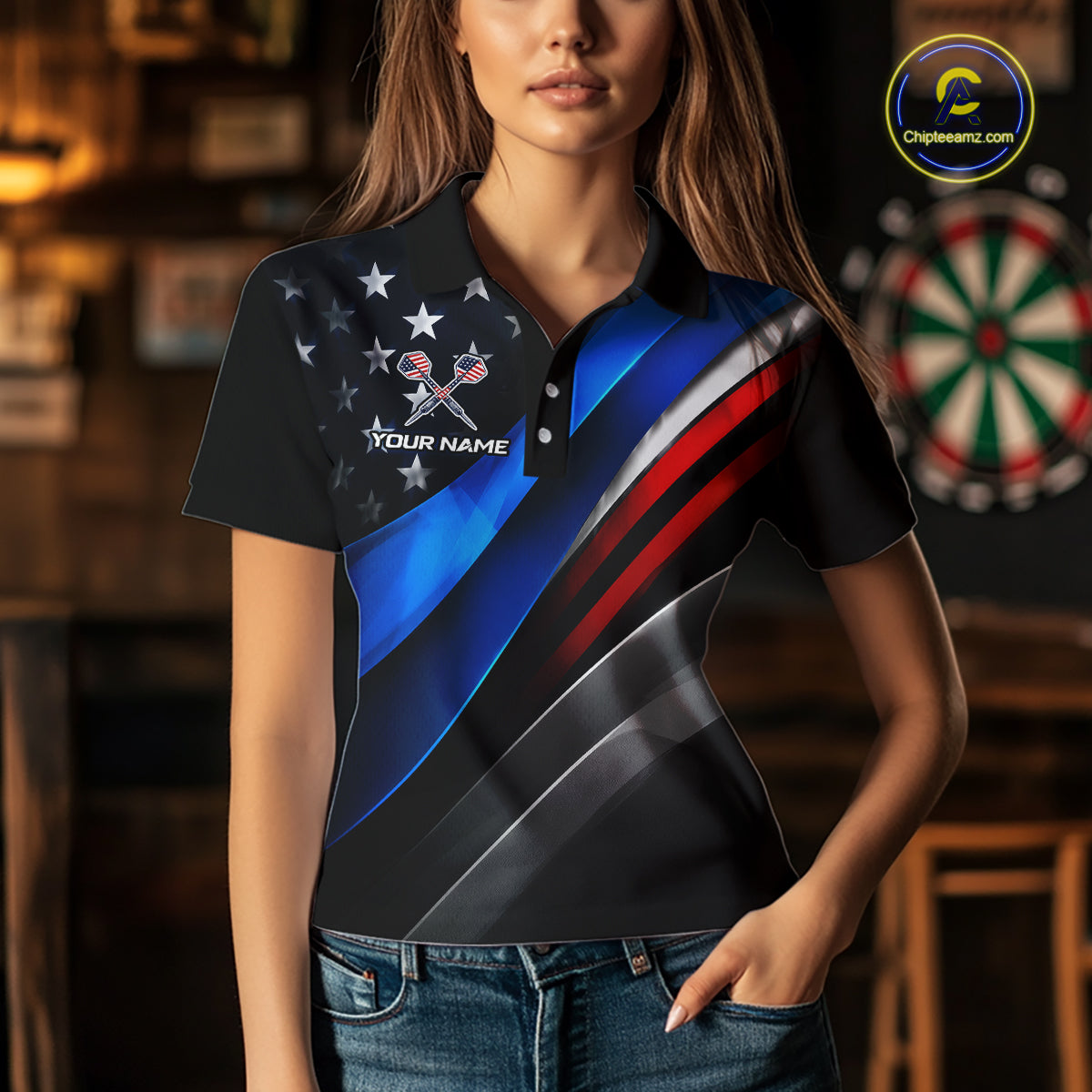 A woman wearing a custom dart polo shirt featuring a patriotic dartboard graphic with red, blue, and silver diagonal stripes in a professional dart room.