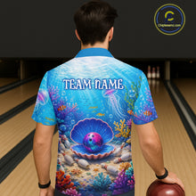Load image into Gallery viewer, Person wearing a colorful bowling shirt with an underwater design and 'TEAM NAME' text, standing in a bowling alley.