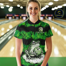 Load image into Gallery viewer, A woman stands in a bowling alley wearing a green and black short-sleeve bowling shirt with a frog and bowling ball graphic on the front. The shirt has a mock neck, black quarter-zip, and a custom name patch on the chest.