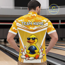 Load image into Gallery viewer, Male model wearing a custom yellow duck bowling quarter-zip shirt back view displaying the personalized team name above a cool cartoon duck wearing sunglasses graphic at the bowling alley
