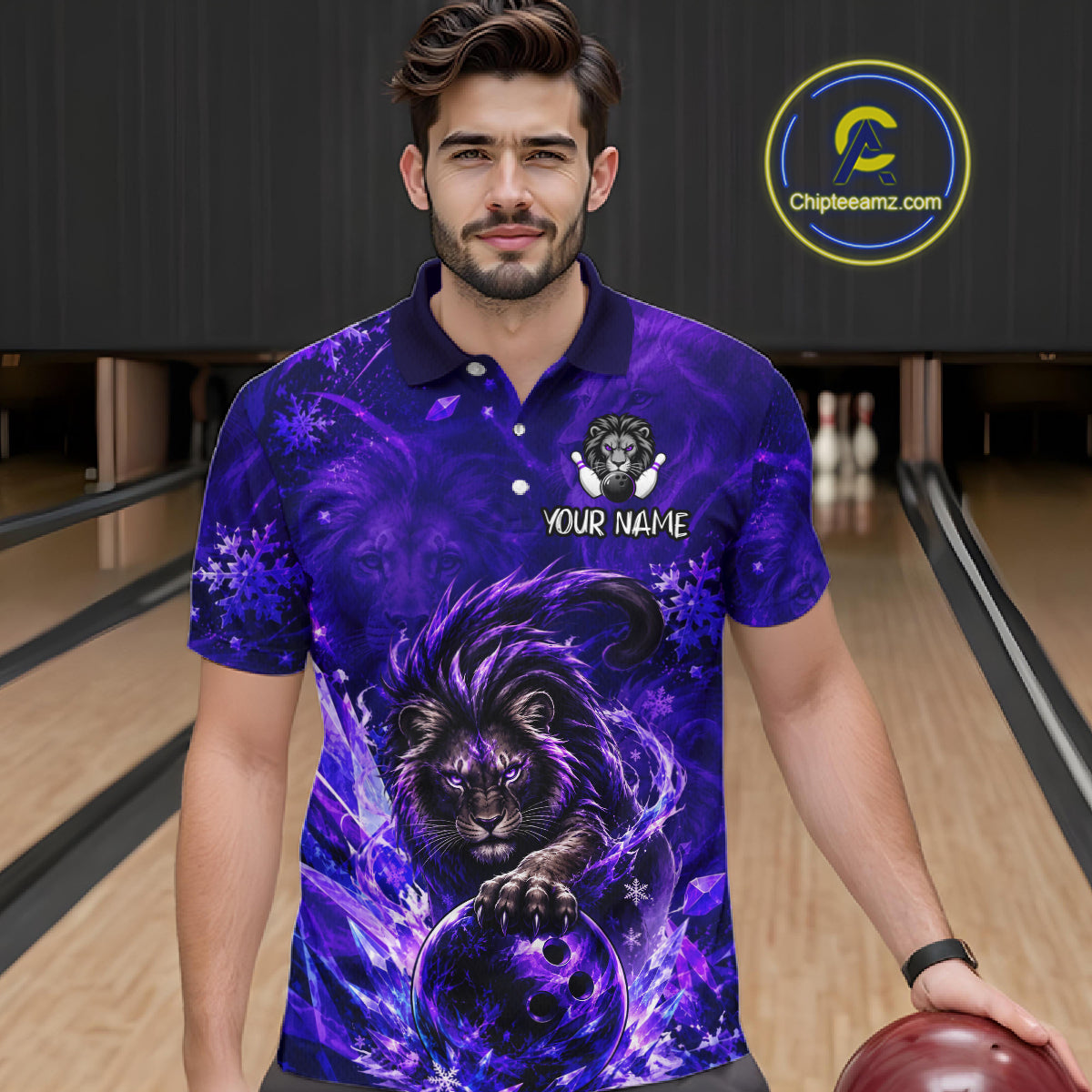 A man wearing a purple and blue bowling-themed graphic polo shirt with a lion design, standing in a bowling alley. The shirt features a lion holding a bowling ball with the text 'YOUR NAME' and a team logo on the chest.