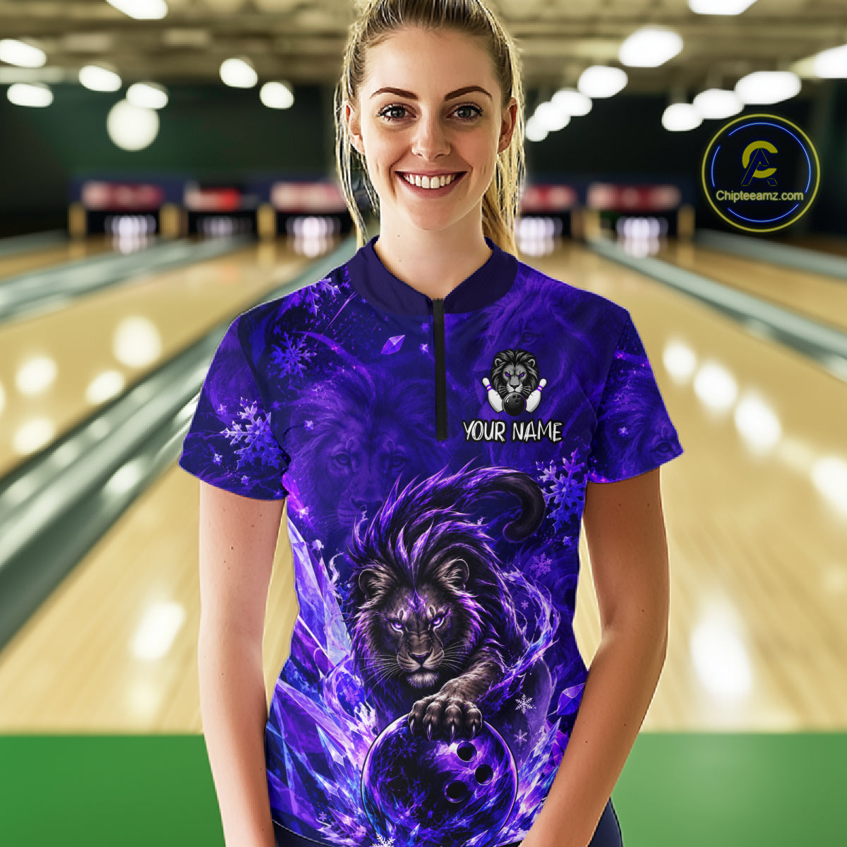 A woman wearing a purple bowling-themed short-sleeve polo shirt with a lion graphic and 'YOUR NAME' text, standing in a bowling alley. 