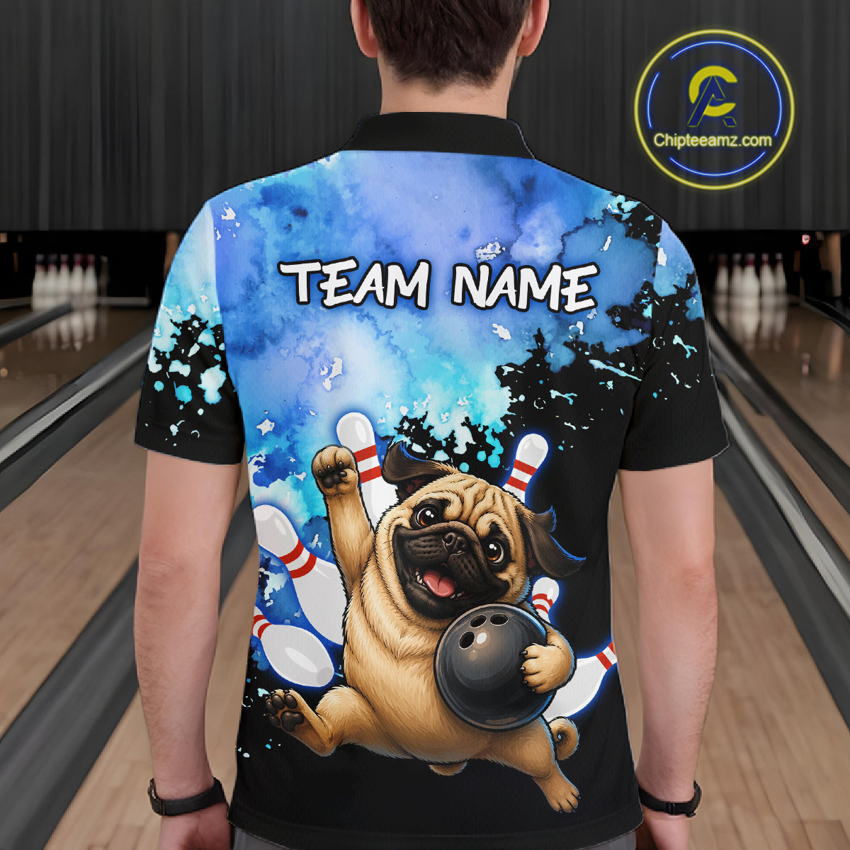 A person shown from the back wearing a custom bowling-themed short-sleeve shirt with a cartoon pug holding a bowling ball and the text 'TEAM NAME' on the back. The background depicts a bowling alley with lanes and pins.