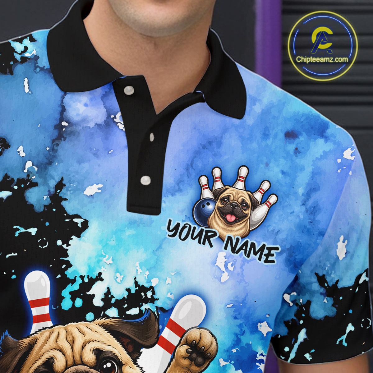 A close-up of a person wearing a blue and black watercolor-patterned polo shirt with a custom bowling-themed graphic featuring a pug dog, bowling pins, and the text 'YOUR NAME'.