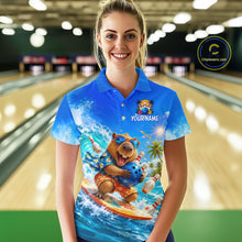 Load image into Gallery viewer, Person wearing a blue polo shirt with a bear graphic and 'Your Name' text in a bowling alley.