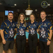Load image into Gallery viewer, A team of four pool players stand in front of a blue felt pool table in a billiards room. All four are wearing the front view of the custom blue and yellow billiards polo shirt with a bulldog and 8-ball motif, and 'YOUR NAME' text placeholder. 