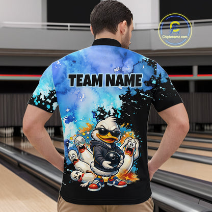 Person wearing a colorful bowling shirt with a cartoon duck design in a bowling alley.