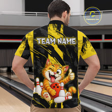 Load image into Gallery viewer, Male model wearing a custom black yellow cat bowling quarter-zip shirt back view displaying the personalized team name above a playful cartoon cat graphic at the bowling alley