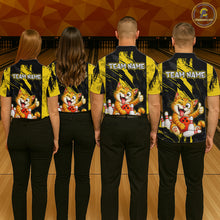Load image into Gallery viewer, Group of four wearing custom black yellow cat bowling shirts back view displaying personalized team names above playful cartoon cat artwork on a yellow black paint stroke background at the bowling alley