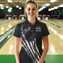 Load image into Gallery viewer, Female model wearing a custom black patriotic bowling polo shirt front view featuring a distressed American flag, bald eagle emblem and grunge pattern at the bowling alley