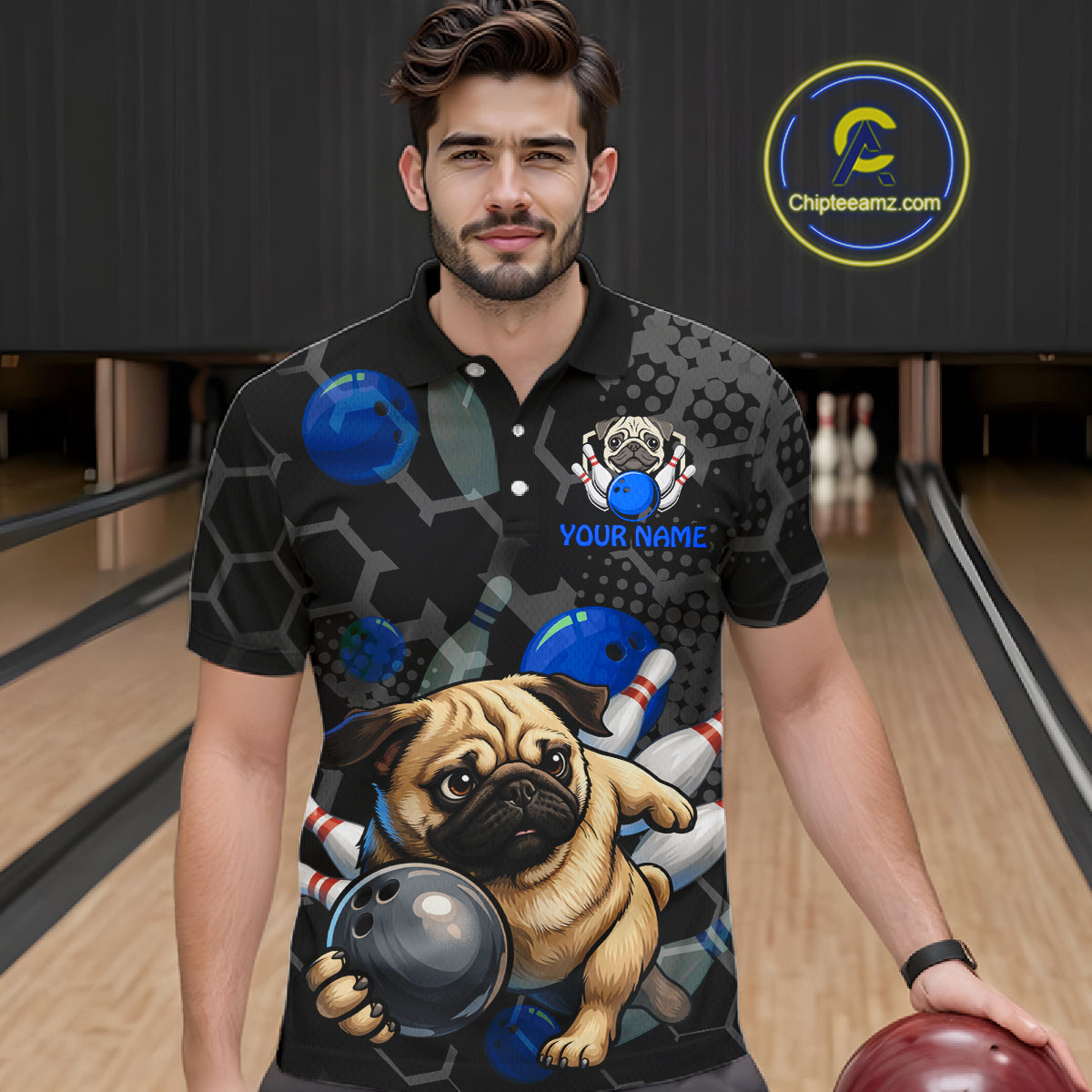 Man wearing a bowling-themed shirt with a pug design on a bowling alley.