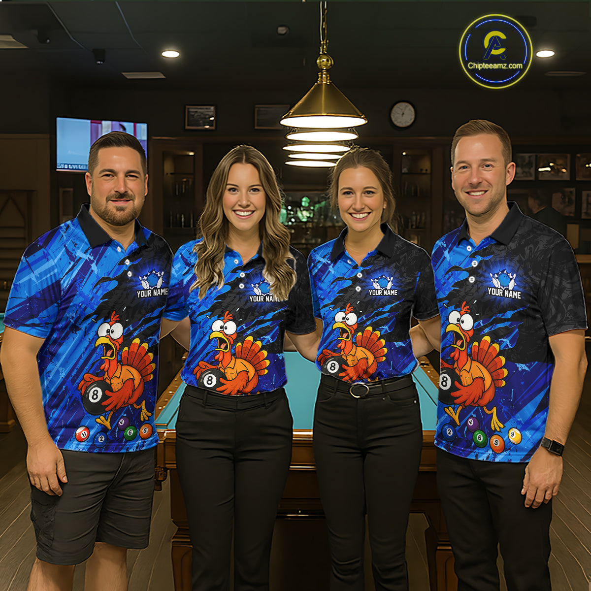 Four people standing together in a bar or lounge setting, wearing matching blue graphic polo shirts with a large cartoon turkey design and black pants. A pool table is visible behind them