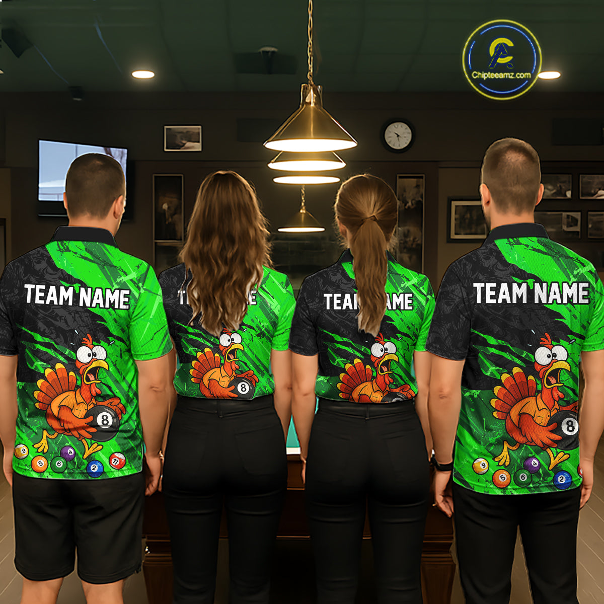 Four people standing with their backs to the camera in a dimly lit indoor room, wearing matching custom-designed sports jerseys. The jerseys feature a vibrant green and black pattern with a cartoon turkey graphic, pool balls, and the text 'TEAM NAME' on the back.