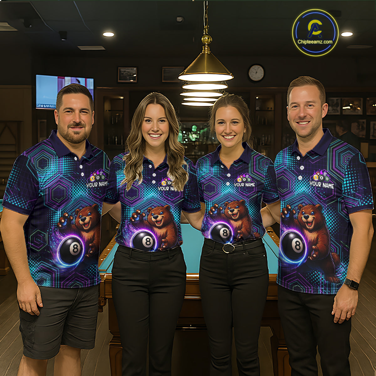 Four people wearing matching bowling shirts with a bear and ball design in a bowling alley.