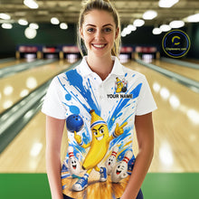 Load image into Gallery viewer, Person wearing a colorful bowling shirt with cartoon characters in a bowling alley.
