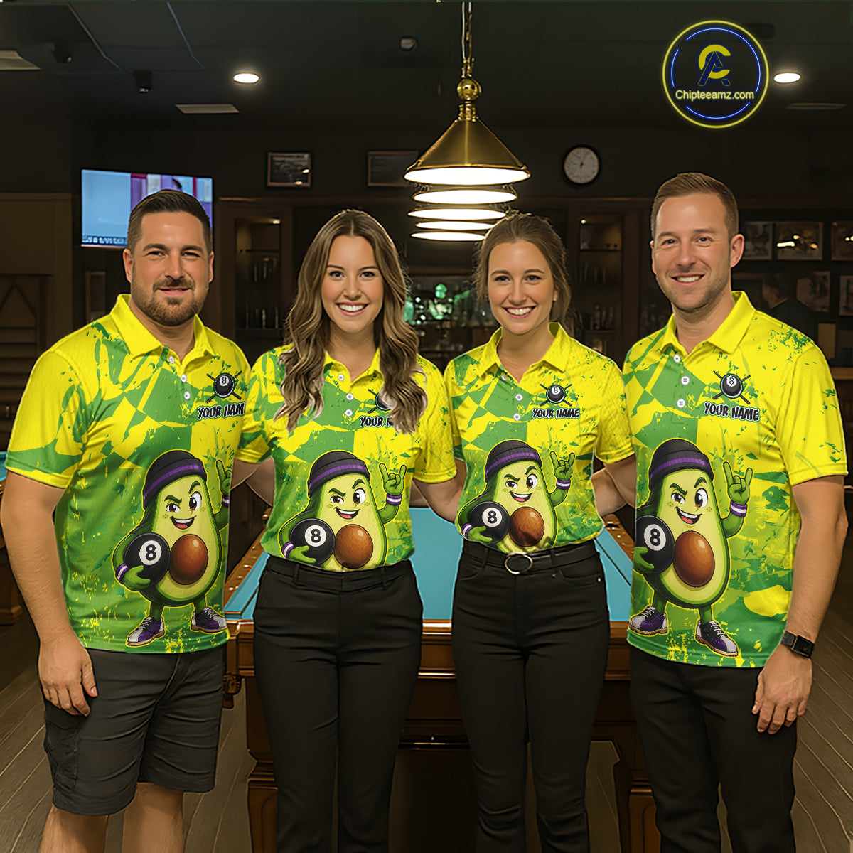 Four people wearing matching green and yellow bowling shirts with a logo in a bowling alley.
