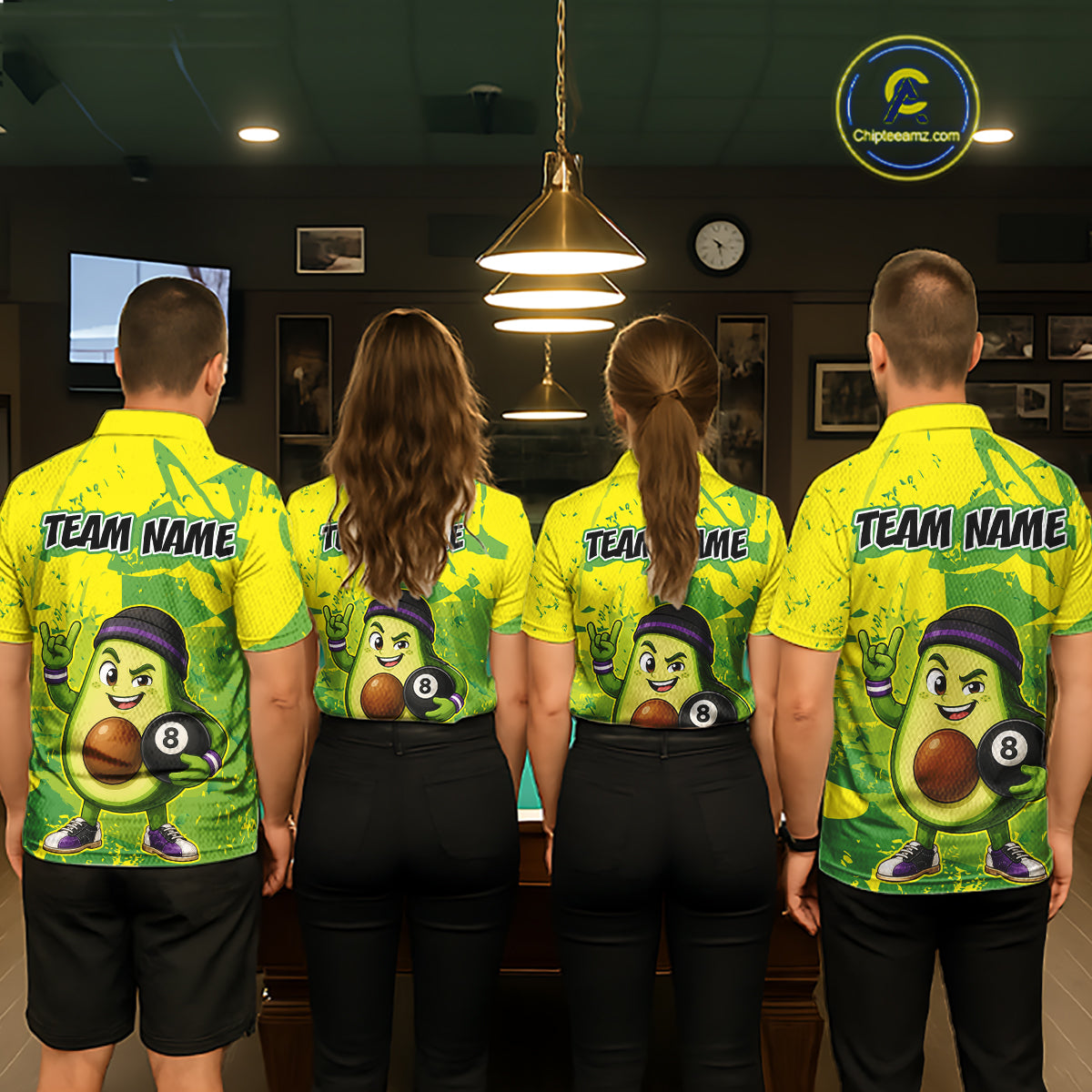 Four people wearing matching yellow and green sports jerseys with a team name on the back in a room.