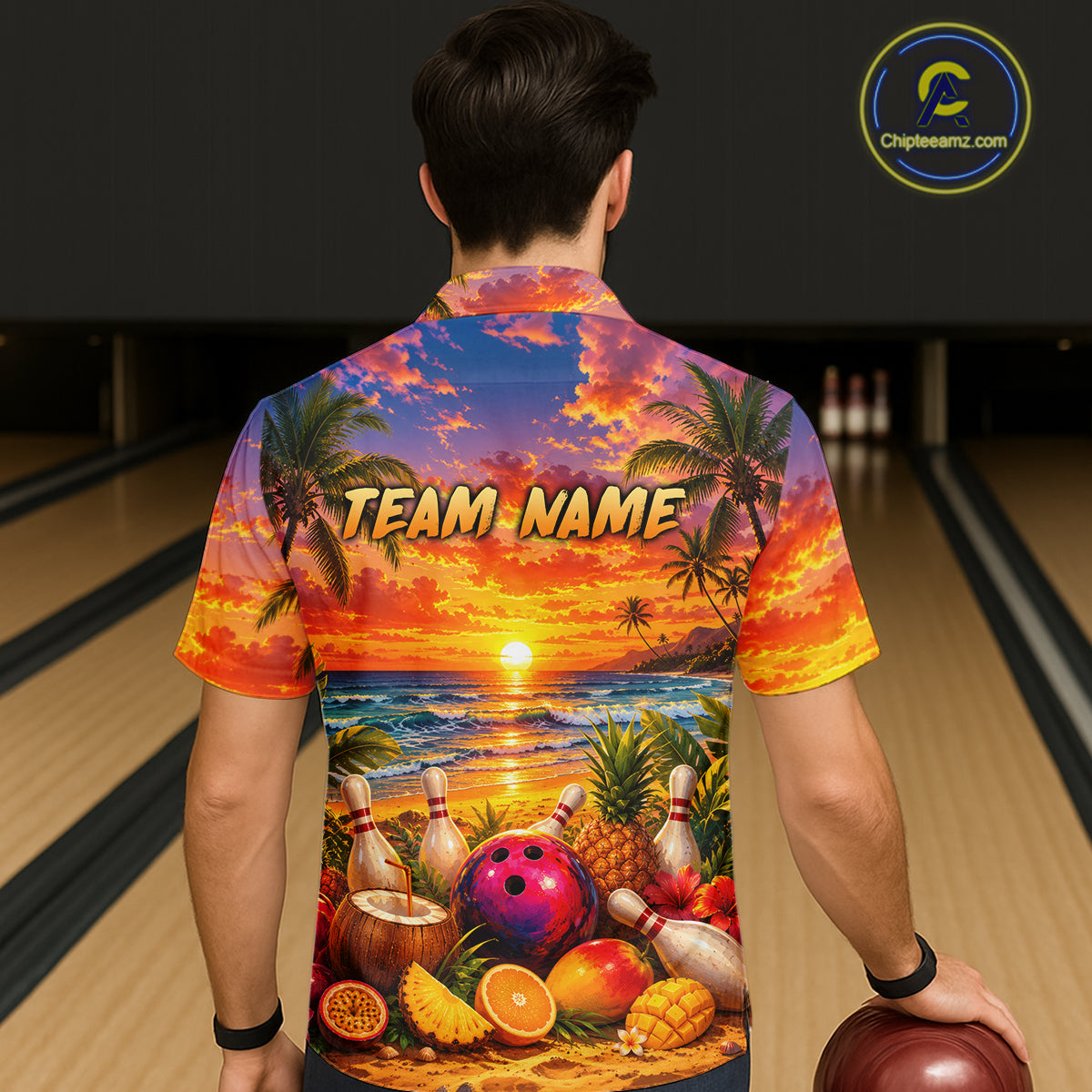 Person wearing a colorful bowling shirt with a tropical design and 'TEAM NAME' text in a bowling alley.