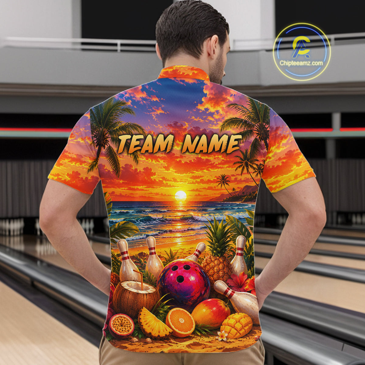 Person wearing a colorful bowling shirt with a beach scene and 'TEAM NAME' text in a bowling alley.