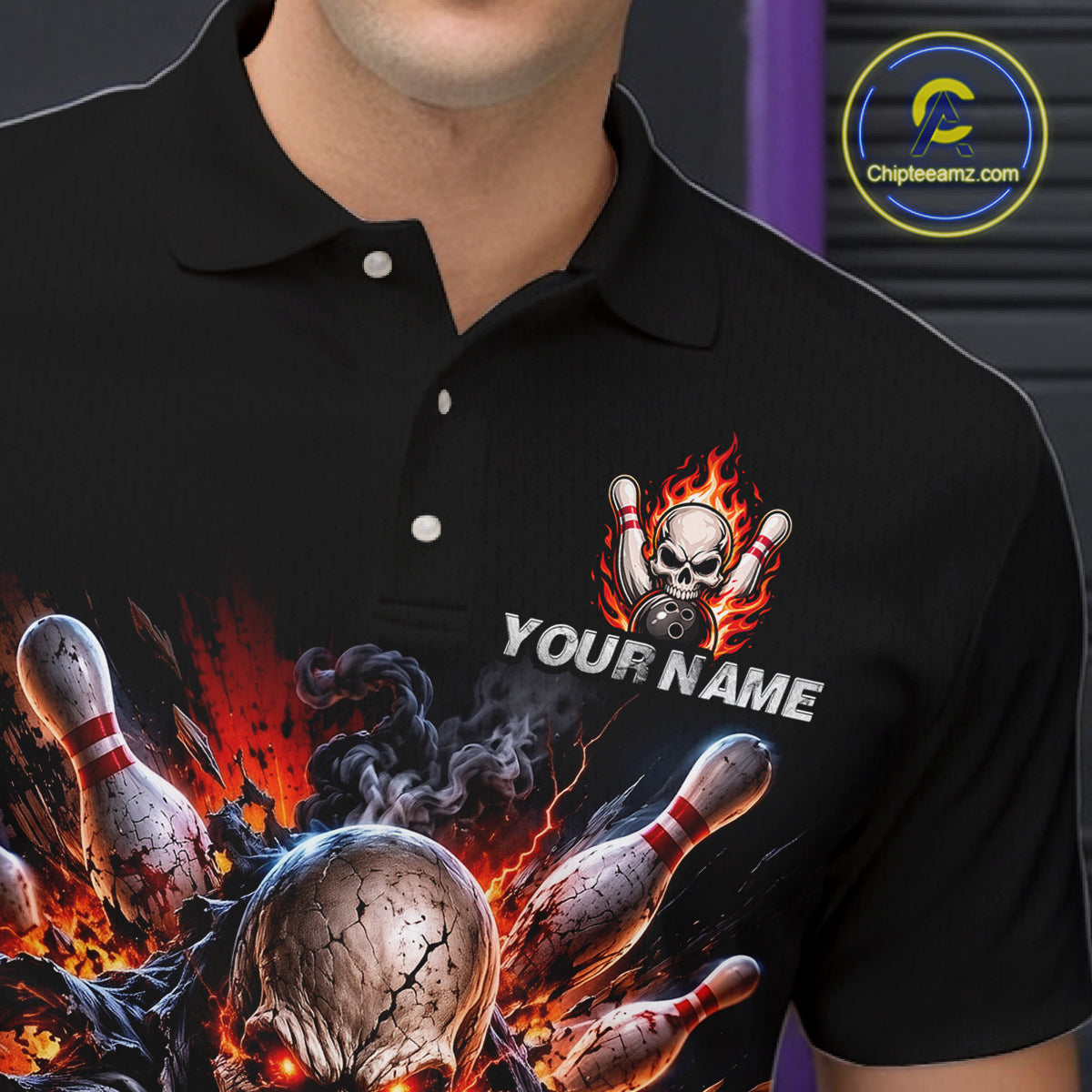 Black polo shirt with fiery skull and bowling design, customizable text area, brand logo visible.