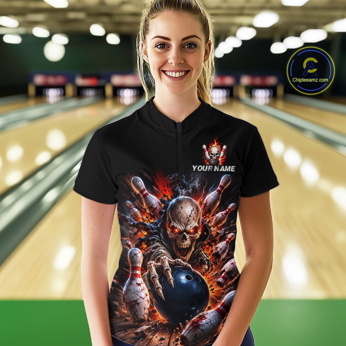 Person wearing a black quarter-zip jersey with a graphic design of a skeleton holding a bowling ball and pins in a bowling alley.