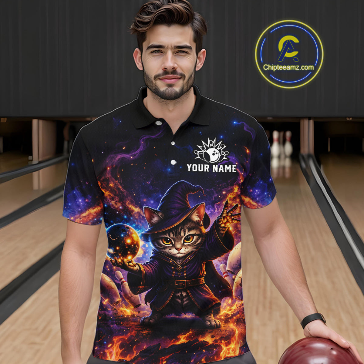 Man wearing a black polo shirt with a cat wizard design on a bowling alley.