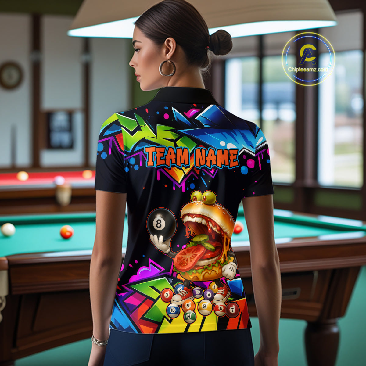 Person wearing a colorful shirt with a graphic design in a pool hall.