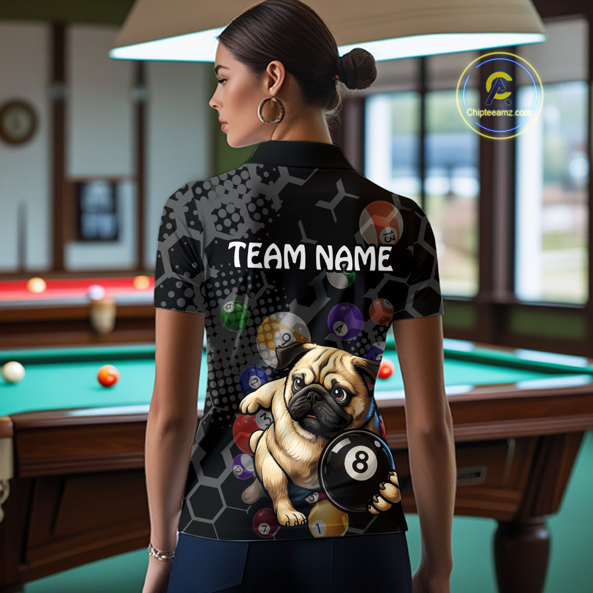 Person wearing a shirt with a pug and pool ball design in a billiards room.