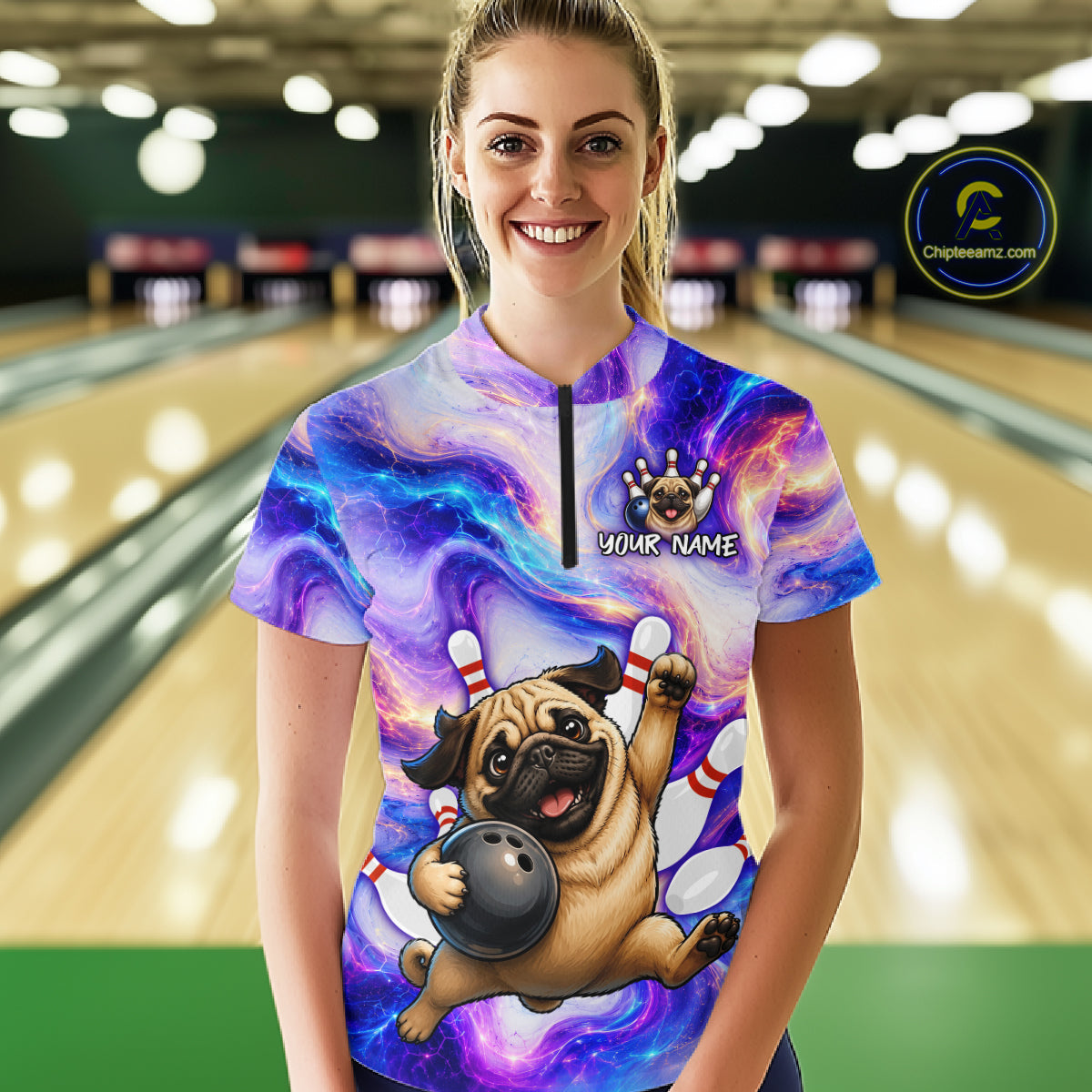 Woman wearing a colorful bowling-themed shirt with a pug design in a bowling alley.